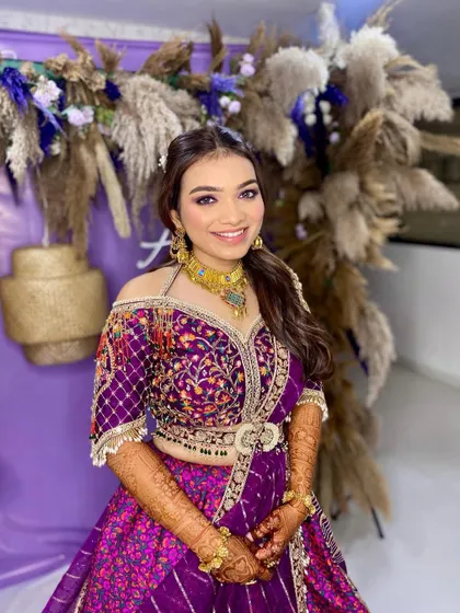 A full look of this dewy glam creation. The makeup is designed to look fresh and vibrant, perfect for a festive occasion.