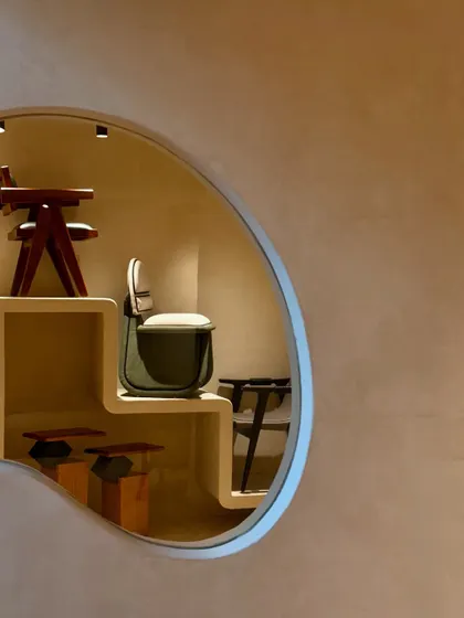A glimpse of our new store through a unique, organically shaped window. I designed the space to be full of calm and beautiful forms, shapes, and materials.