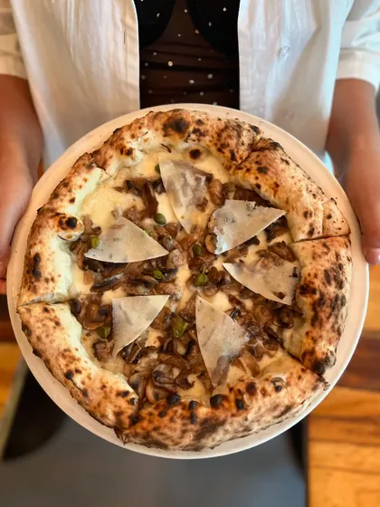 Our Funghi e Capperi Pizza is a simple yet bold combination of flavors, perfect for all mushroom lovers. It's a white pizza, so the earthy mushroom flavour really shines.
