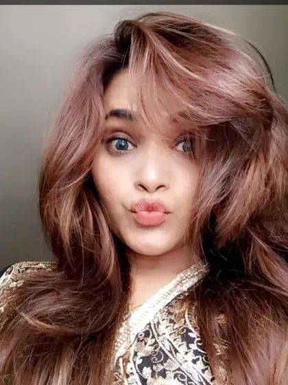 A fun selfie from the client, showing off her new, even hair color after a correction.