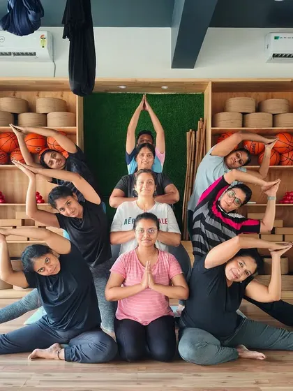 The Hamsa tribe in a beautiful, multi-layered group pose. We love getting creative and having fun together.