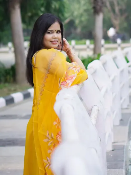 A classic over-the-shoulder pose during an outdoor portfolio session. The lighting is soft and natural.