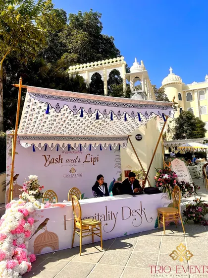 An elegant hospitality desk at The Everest Hill Resort, designed with traditional motifs and fresh flowers to welcome guests with warmth and style.