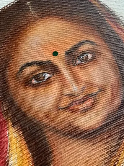 A close-up of the acrylic portrait, revealing the brushwork and color blending used to create the warm skin tones and expressive eyes. We teach these fine details in our portrait painting classes.