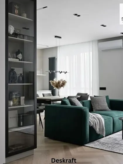 This shot reveals the open connection to the dining area and the clever use of a glass-paneled shelf as a subtle room divider, maintaining an airy feel.