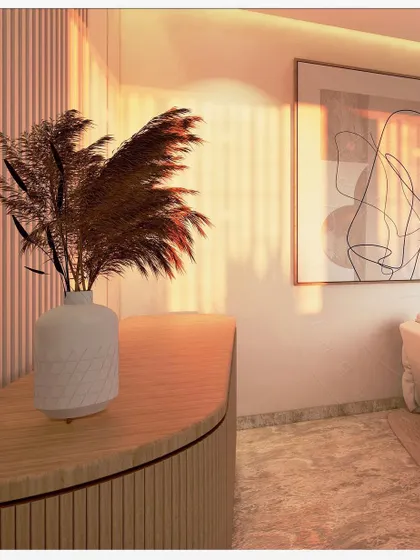 A detail shot from a living space, highlighting the interplay of light, texture, and form. The warm sunlight catches the vertical fluting on the curved console table and the pampas grass arrangement. This image captures the essence of creating a home where peace and light reside.