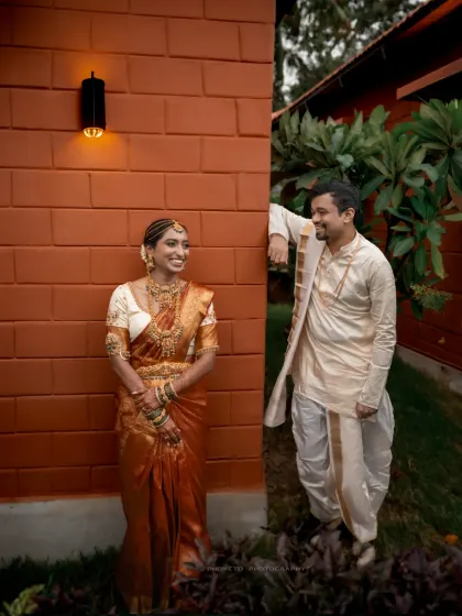 A stylishly composed shot of the couple, using architectural elements to frame their portrait.