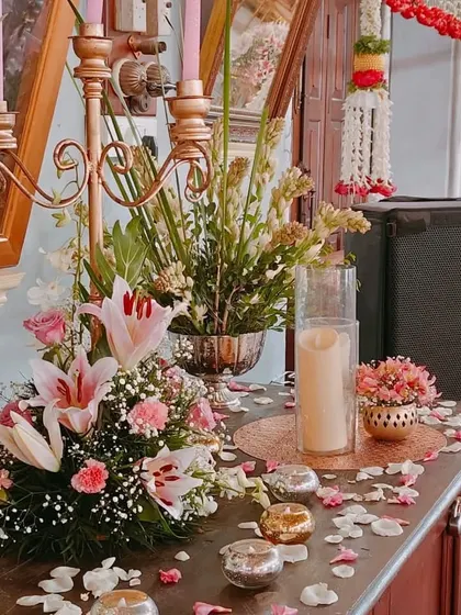 Another close-up of the decor details, showing how we use a mix of flowers like lilies and carnations, along with candles, to create beautiful vignettes throughout the venue.