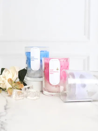 My iced latte candles are cool, creamy, and oh-so-fragrant. This image displays the Strawberry, Blueberry, and clear iridescent options, perfect for adding a touch of aesthetic to your home.