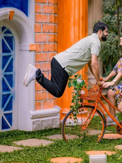A playful, "levitating" pose with a bicycle. I love getting creative and having fun with my couples to capture unique and memorable shots like this one.