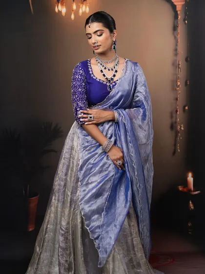 A full-length view of this stunning blue and silver reception outfit, with makeup designed to complete the look.