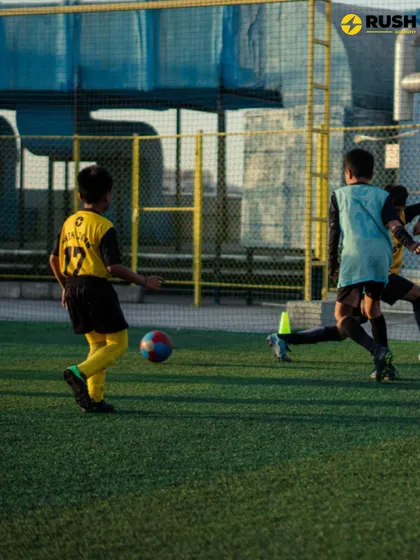 Players compete for the ball during a fast-paced drill, improving their reaction time and agility.