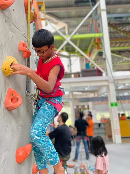 A young climber tackles a route in our air conditioned facility, proving that you can have an adventurous and challenging workout even on the hottest days.