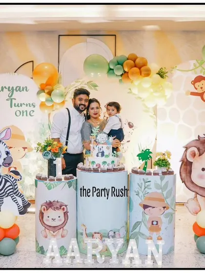 Another beautiful family photo in front of a custom jungle-themed backdrop. I ensure my decor looks great from every angle, providing plenty of photo opportunities for guests.