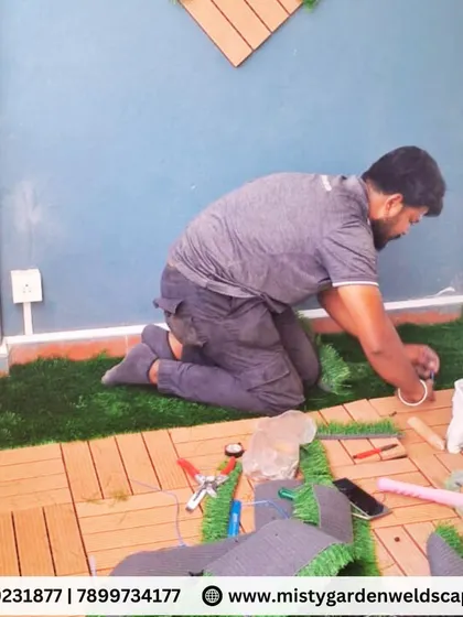 Our team at work, demonstrating the precision required to install custom flooring in a small and uniquely shaped balcony space.