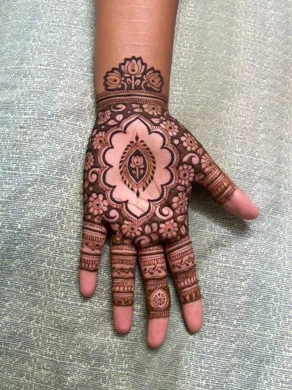A close-up of the cutwork paisley design, highlighting the fine lines and the use of negative space.