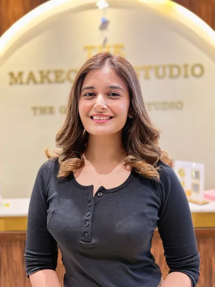 The smile says it all. After her balayage transformation, her hair looks brighter, healthier, and perfectly styled to complement her features.