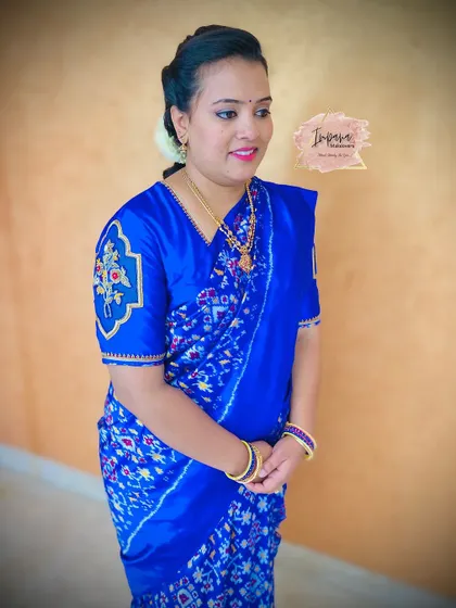 Another shot of this elegant guest makeover. The simple hairstyle and natural makeup allow her beautiful saree and embroidery to stand out.