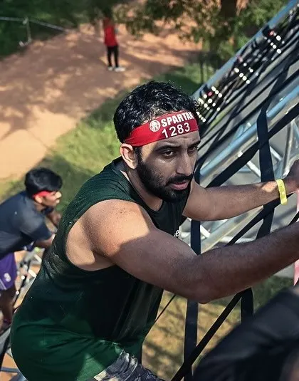 Climbing the cargo net at the Spartan Race. It's a full-body challenge that tests your strength and coordination.