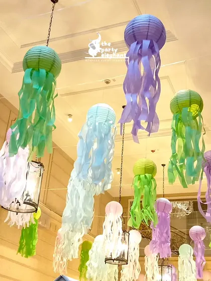 A clearer view of the colorful jellyfish lanterns hanging from the ceiling, creating a beautiful and immersive underwater canopy.