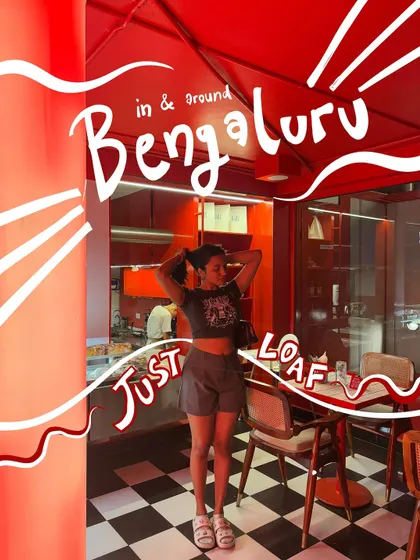 Just loafing around in Bengaluru. This photo gets a full artistic treatment with bold text and white outlines that match the cafe's red interior.