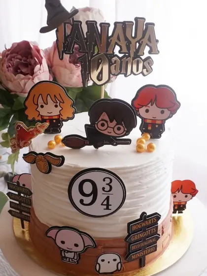 How magical is this Harry Potter cake? Our handmade paper topper set, including cute chibi characters and the Platform 9 3/4 sign, makes it easy to create a themed cake without fancy fondant.