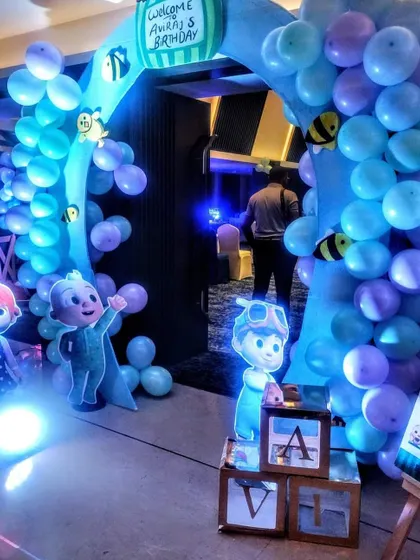 Another angle of the Cocomelon entrance, showing the detail of the balloon work and the placement of the light-up 'A' block.