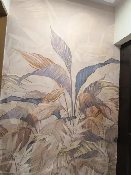A soft, artistic mural of large tropical leaves. The muted colors create a calm and sophisticated feel.