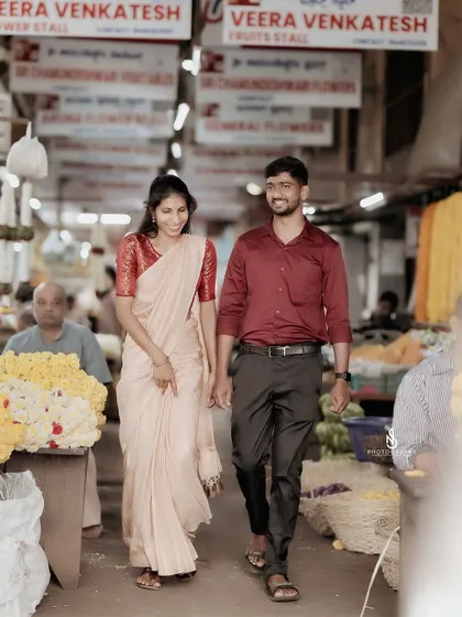 A candid shot of the couple walking through the famous Devaraja Market in Mysore, surrounded by the sights and sounds of the city.