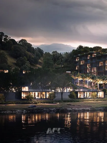 A nighttime view of the Westin Nashik. The warm interior lighting creates an inviting glow, contrasting with the dark, natural landscape and highlighting the hotel as a serene haven.