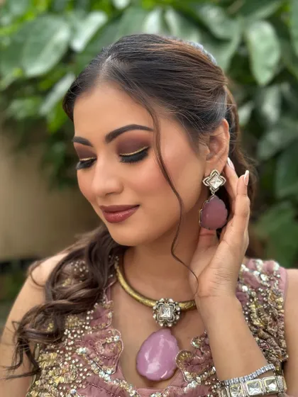 Creating timeless bridal magic. This look features a warm, smokey eye, a defined lip, and glowing skin, perfect for a cocktail or reception event.