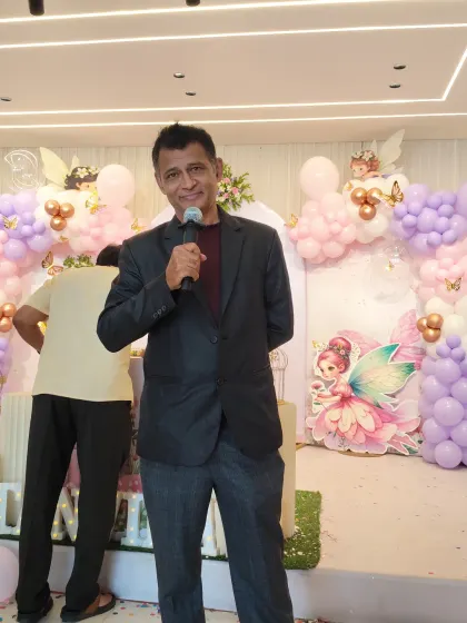 Hosting a fairy-themed birthday party. You can see the beautiful decorations in the background that help create a magical atmosphere for the kids.