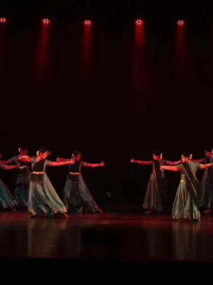 A dynamic group movement from 'Ek Anant'. The flowing costumes and synchronized turns create a beautiful visual spectacle on stage.