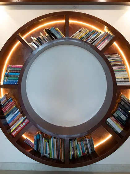The famous circular bookshelf was a key feature in Neeleesh's home. It's a modern and artistic piece that perfectly reflects his love for books and unique design.