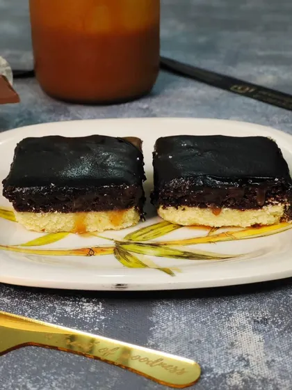 This is my Gourmet Cookie Caramel Brownie. It features a buttery cookie base, a layer of gooey caramel, and a rich brownie topping for a multi-layered flavor experience.