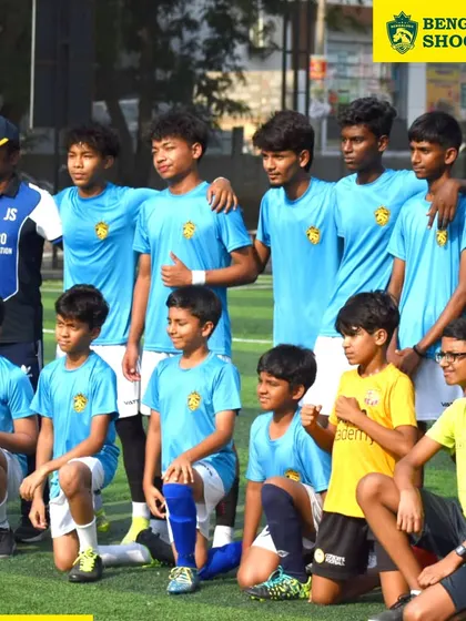 A close-up of our young footballers, united as a team. We focus on building a strong sense of camaraderie among players from different age groups and locations.