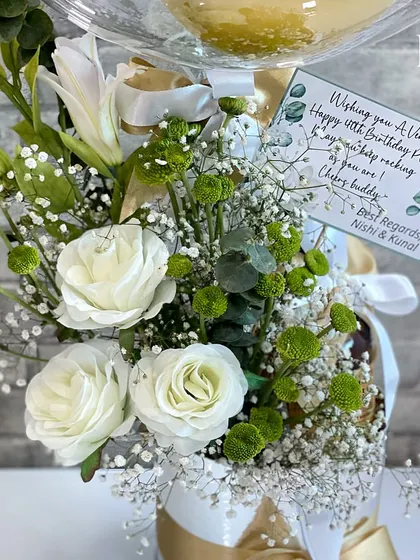 The personalized card for the 40th birthday hamper. A handwritten note adds a warm, personal touch that makes the recipient feel truly celebrated by their friends, Nishi and Kunal.