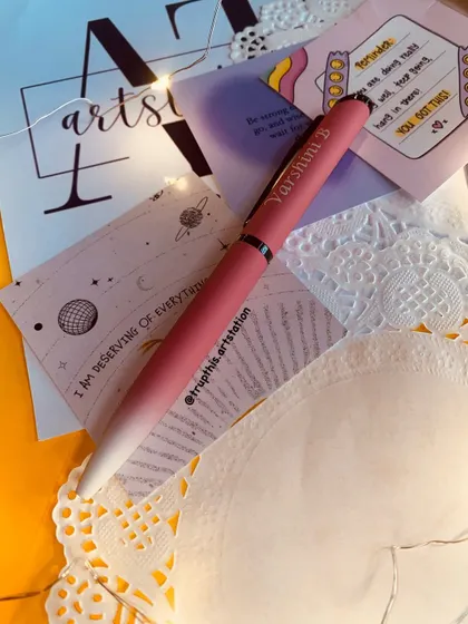 Another angle of the custom engraved pen, displayed with some aesthetic stationery. I have various color options available to match your style.