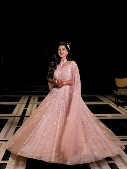 A full-length shot of this stunning engagement bride in her princess gown. The makeup is glamorous and radiant, ensuring she shines like a star on her special night.