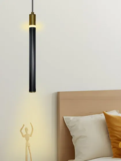 The slim black and gold pendant shown in another bedroom setting, highlighting its minimalist appeal.
