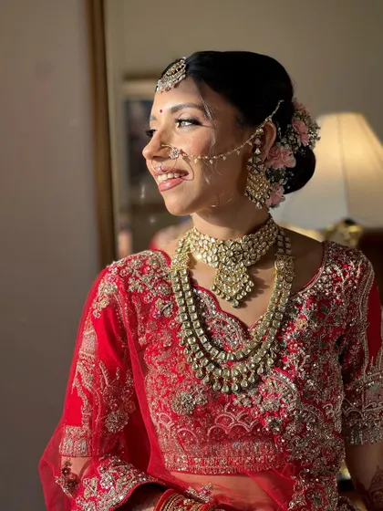 A side profile showing the elegant hair and the floral accessories that we incorporated into her look.