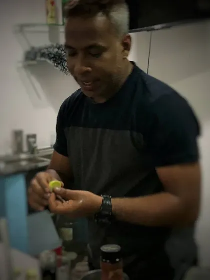 Preparing a fresh lime garnish. The small details matter, and a fresh, aromatic garnish is the perfect finishing touch for a great cocktail.