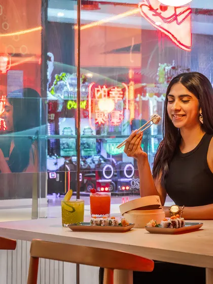 Great design is about creating memorable moments. Here at Lucky Chan, the warm glow of custom neon signs reflects off the surfaces, creating a vibrant, energetic backdrop for guests to enjoy their dining experience.