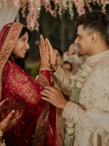 A beautiful moment between the bride and groom. The groom's hand-embroidered sherwani was designed to be as timeless and special as the union it was made for.