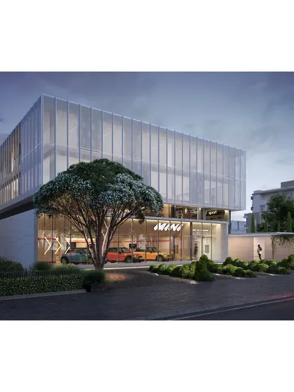 This rendering shows a proposed commercial building with a perforated metallic facade. The pattern is designed to create an ever-changing play of light and shadow, capturing the attention of passersby.