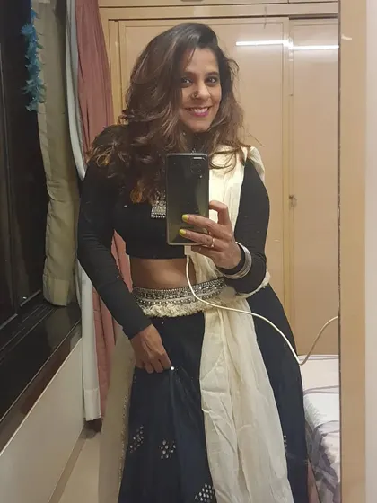 A mirror selfie showing off one of my Navratri outfits. The festival is a time for me to fully immerse in the culture, both in my personal style and my dance.
