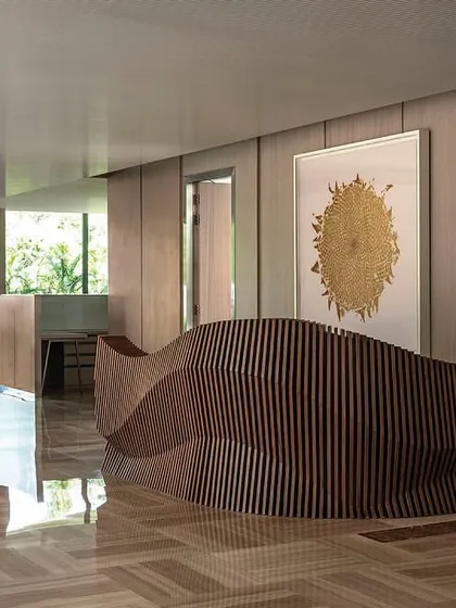 A striking parametric reception table designed for the directors' floor of 'The Layered Office'. The fluid, sculptural form of the desk serves as a piece of functional art in the main circulation space.