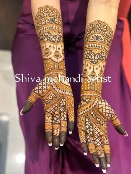 An elegant design with a focus on symmetry and clean patterns. The dark-tipped fingers create a striking contrast with the detailed work on the hands and arms.