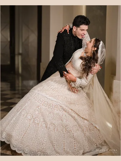A dramatic and romantic dip on the dance floor. This photo captures the fun and elegance of the couple's celebration.