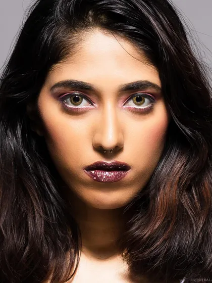A color version of an intense beauty close-up, highlighting the model's eyes and glittery lips.